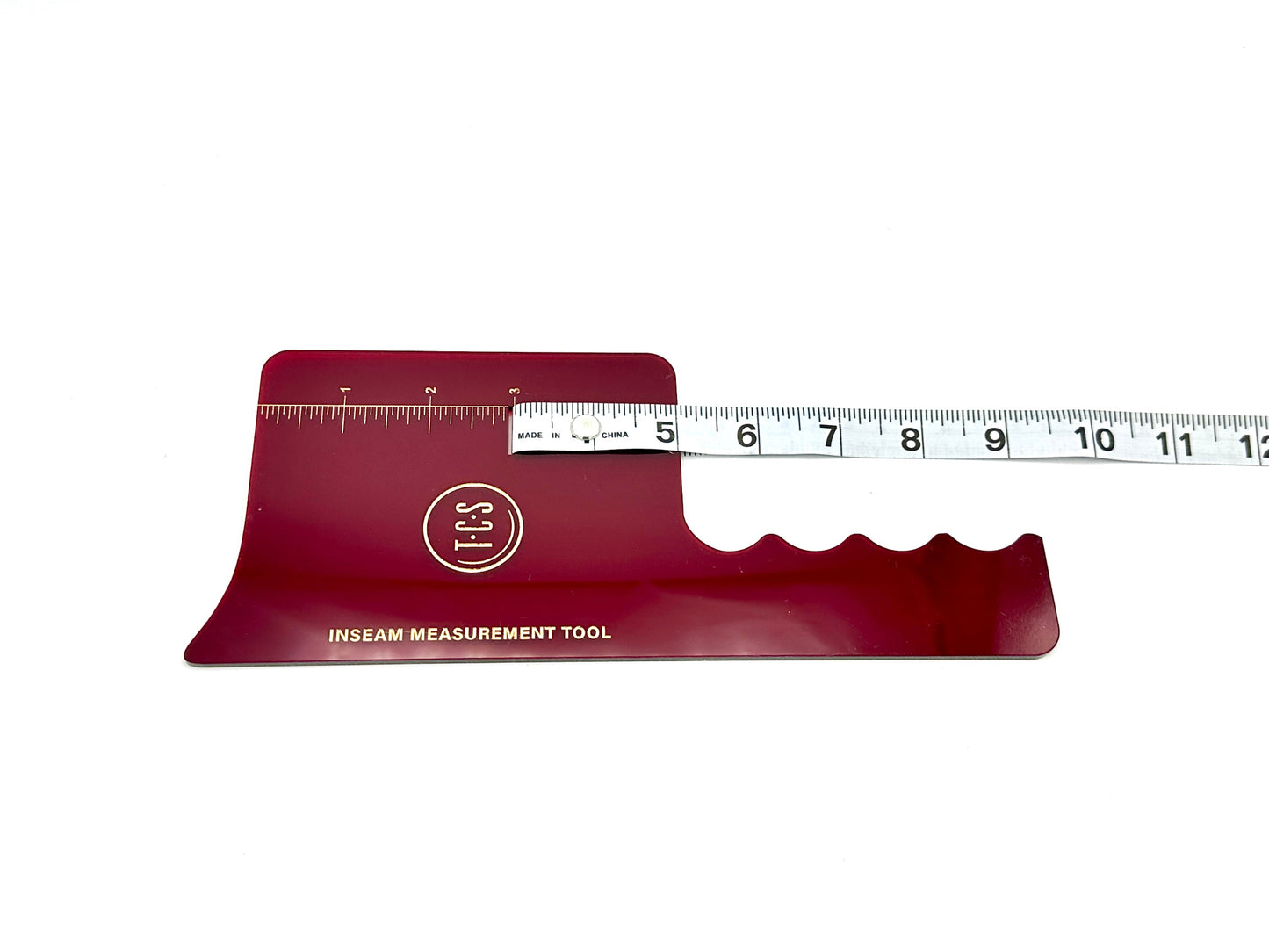 Red plastic transparent inseam measuring tool with attached measuring tape