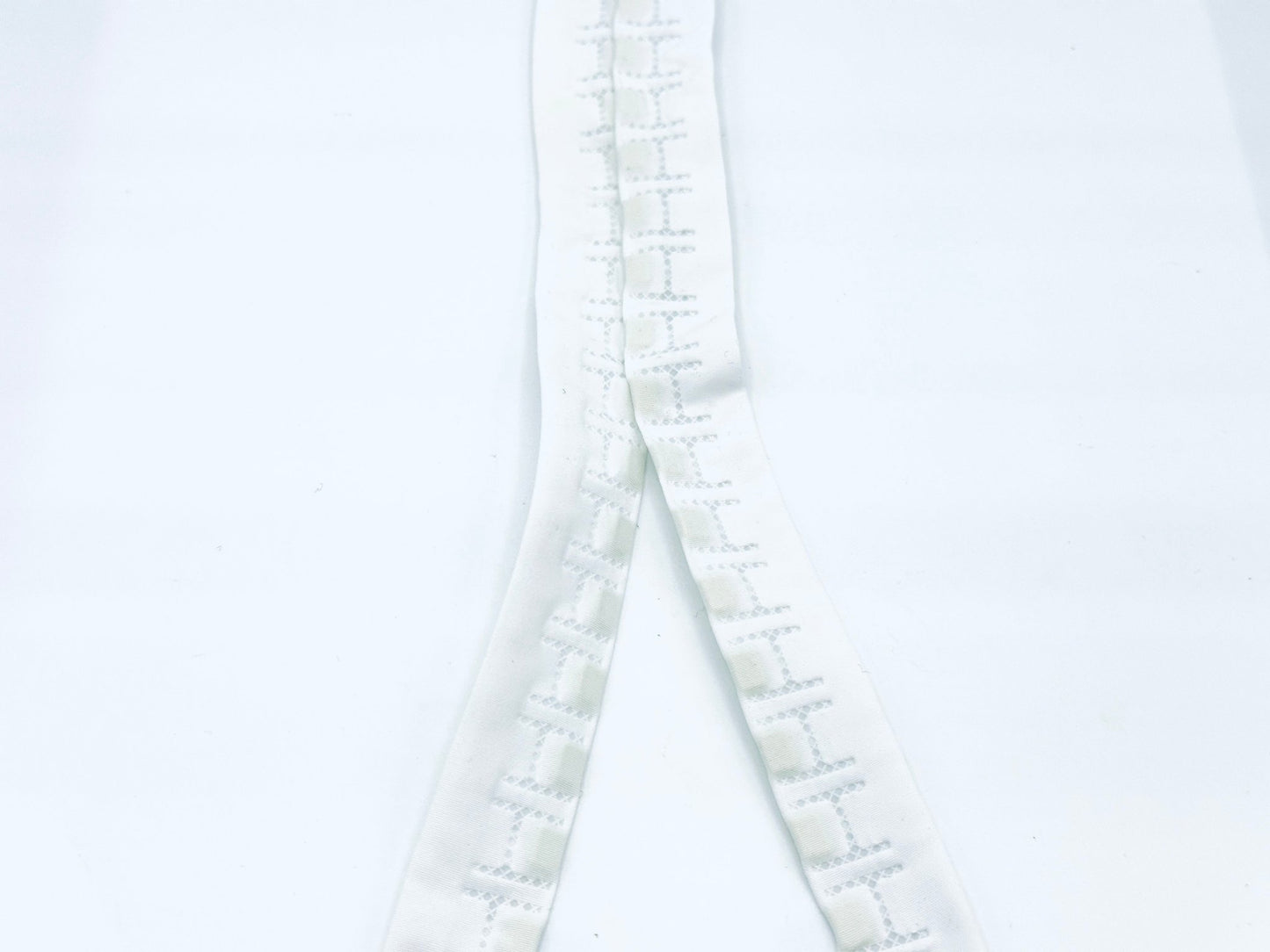 white nylon tape with magnets on each side 1 cm apart