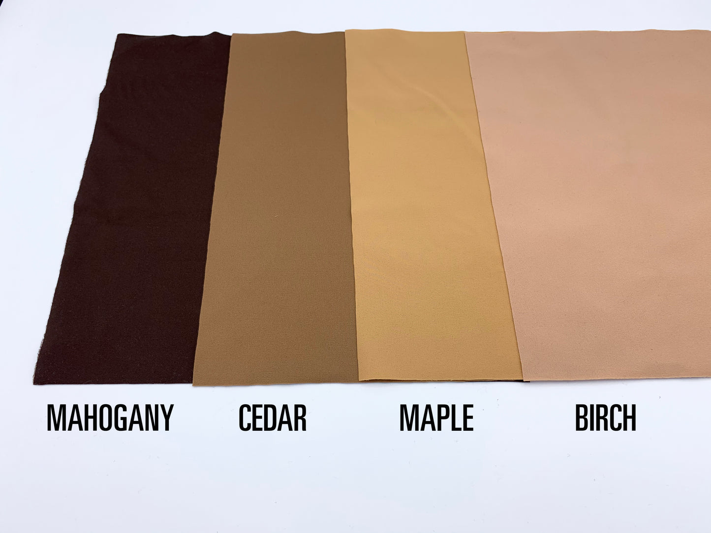 Swatches of Modesty Pouch colors; Mahogany, Cedar, Maple and Birch