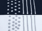 Black and white fabric with grey sock stop painted on in dots and stripes