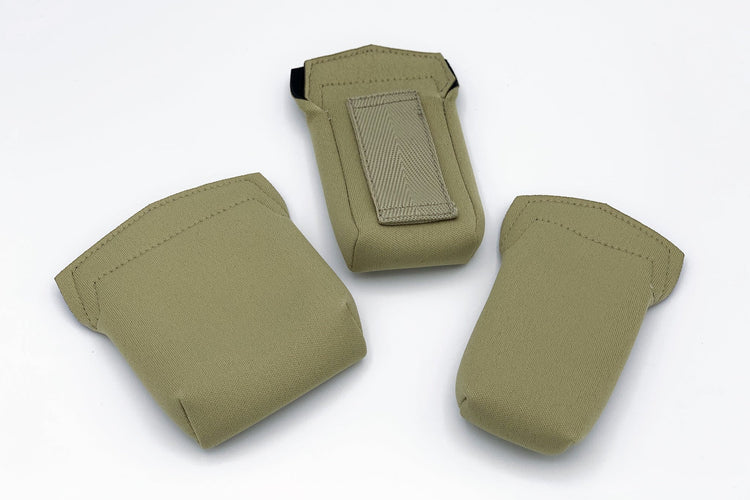 Three wireless mic packs in beige