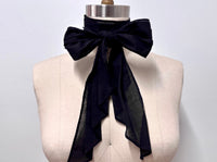 Black cotton lawn cravat tied in a bow on a mannequin