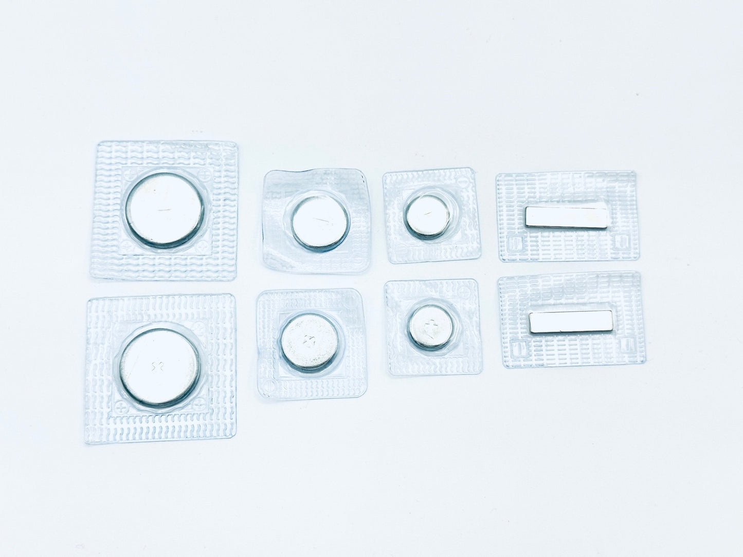 4 pairs of sew in magnets in plastic; 1 pair 1" large disk, 1 pair 3/4" disk, 1 pair 1/2" disk, 1 pair thin bar