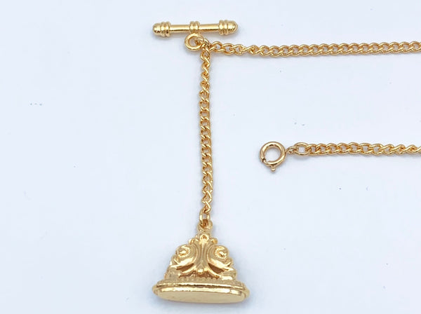 1 goldtone decorative watch fob on goldtone chain with bar to slip on button hole