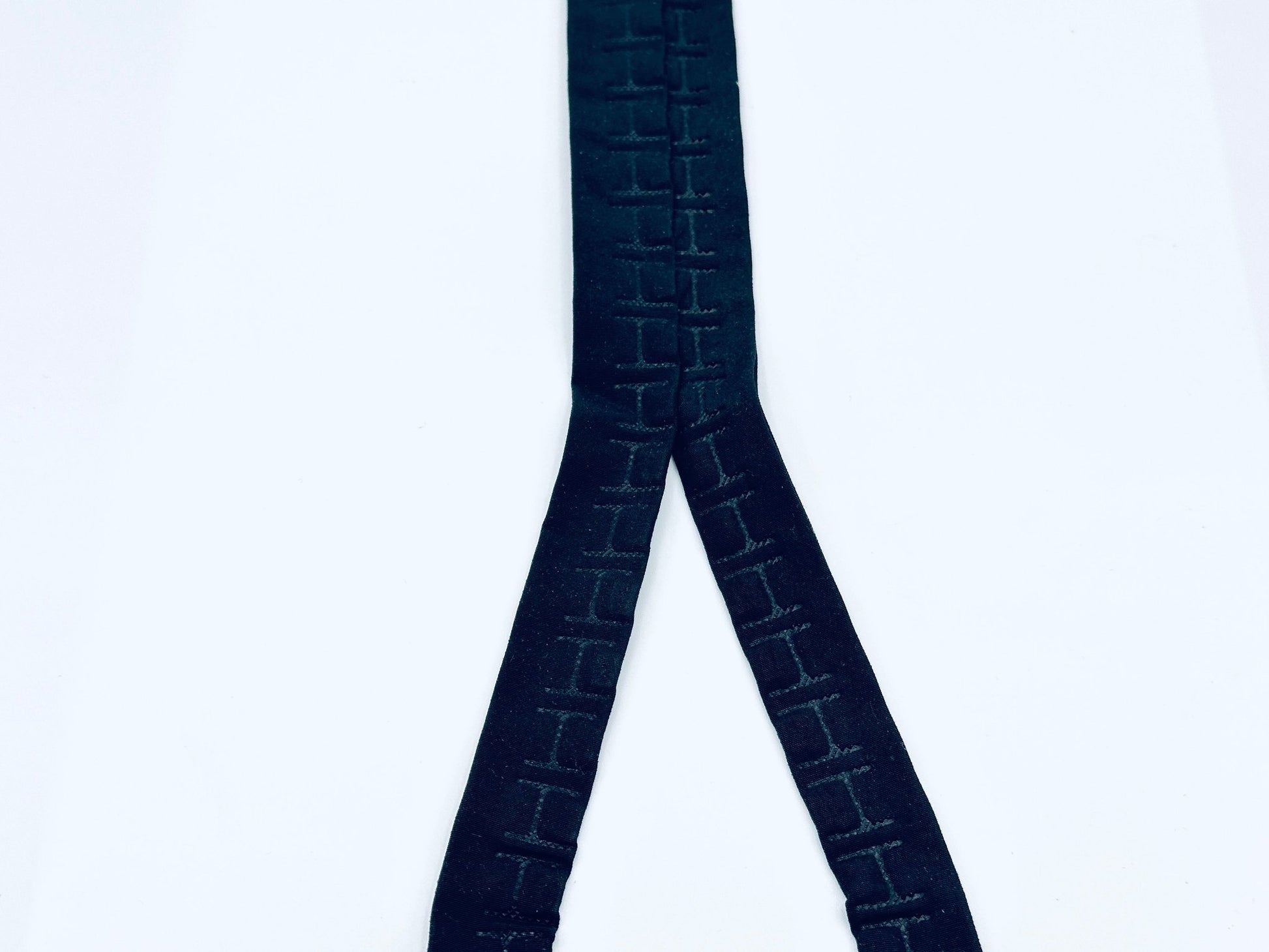 black nylon tape with magnets 1 cm apart on each side