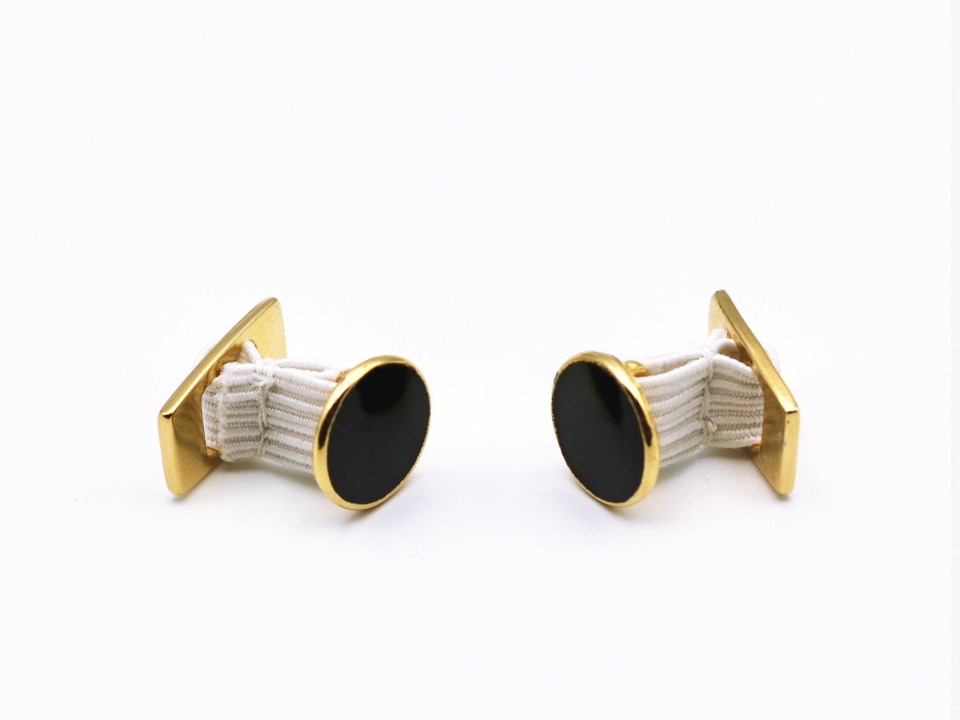 1 pair of black enamel center goldtone quick rigged cufflinks with elastic center