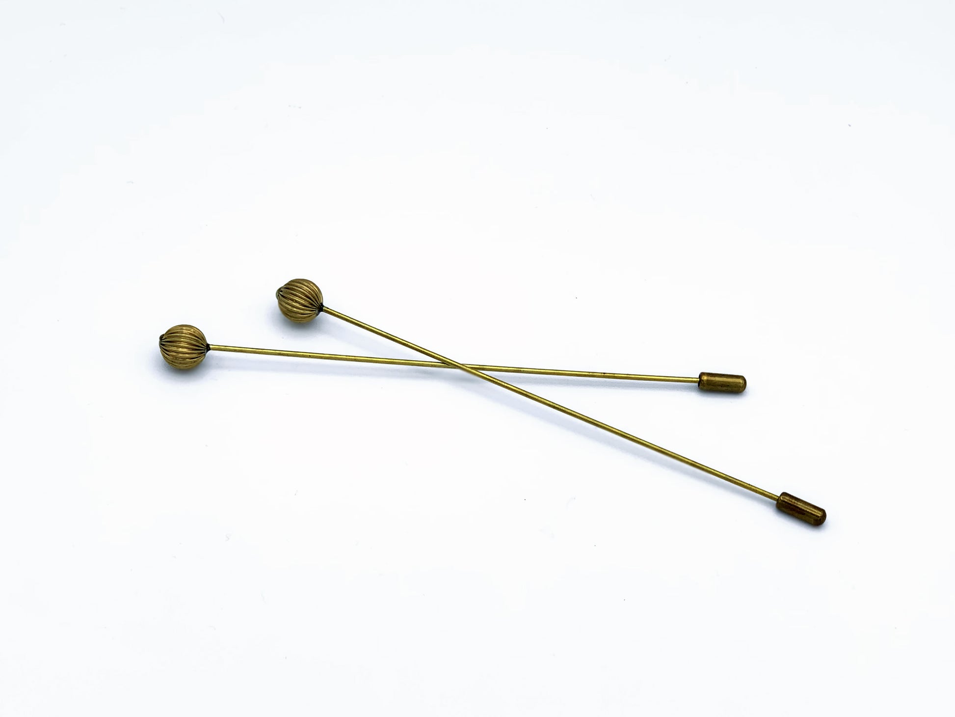 1 pair of brass long hatpins with brass safety clasp and brass decorative finial