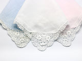 Reproduction vintage handkerchiefs in pastel blue, pink, and white with beautiful crochet corner