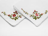 white handkerchief with floral embroidered corner