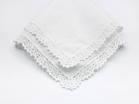 reproduction vintage handkerchief with crochet border on all sides.