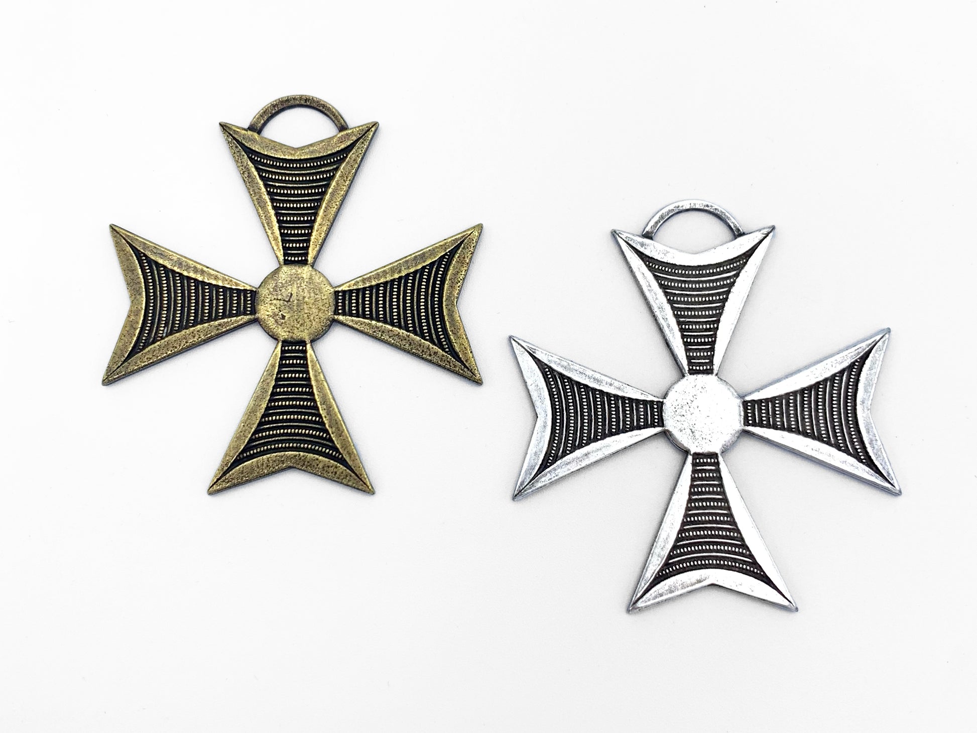 Pair of large Iron Cross medals one in brass and one in pewter