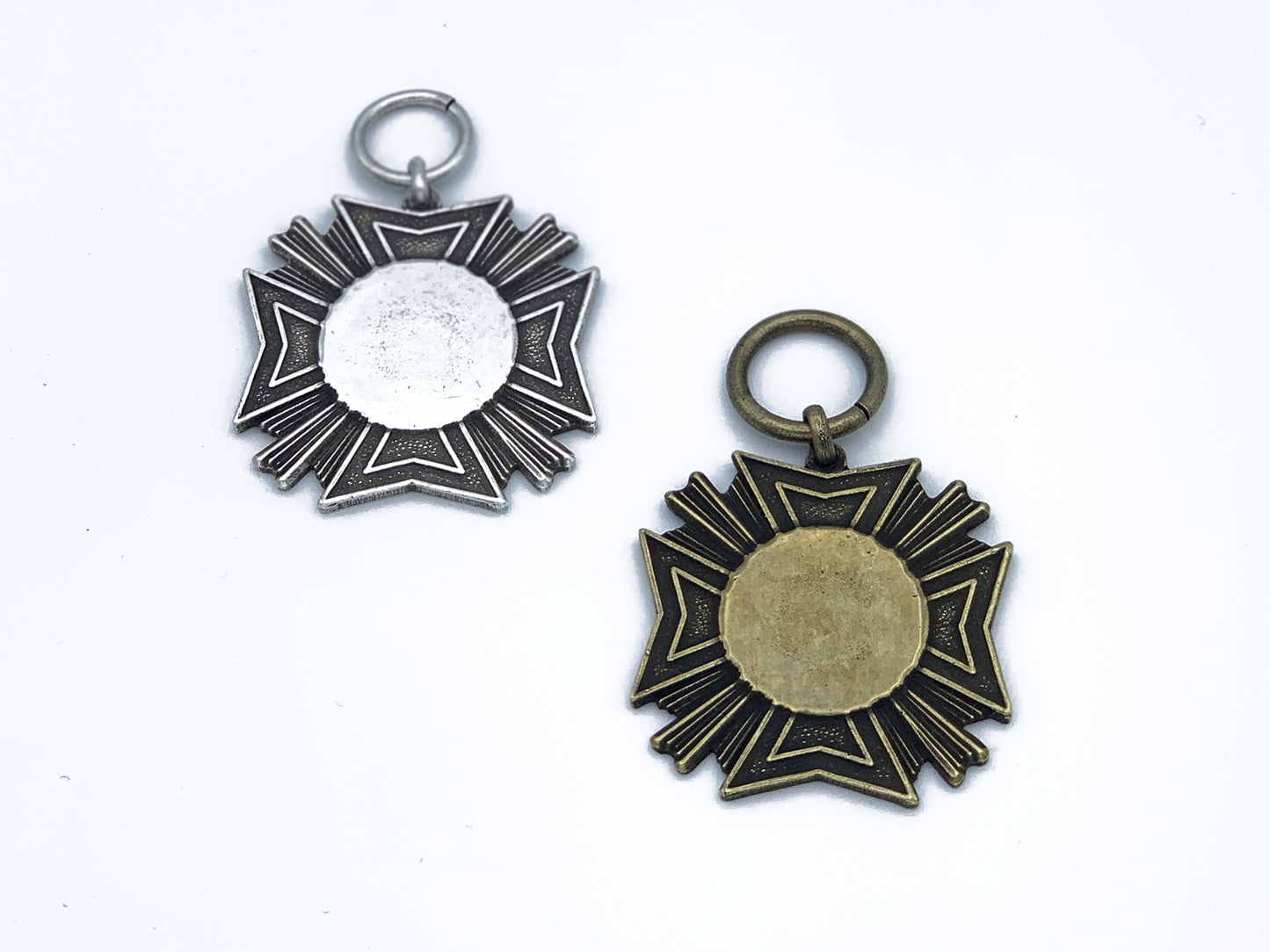 1 pair of Large Maltese Cross one in brass and one in Pewter
