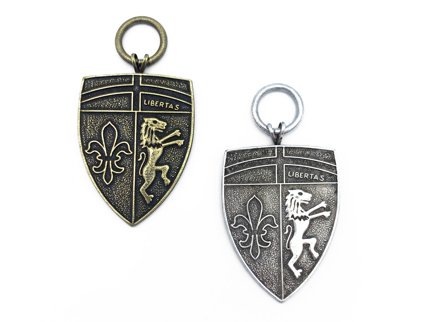 Pair of Large Shield Metals one in brass and one in pewter