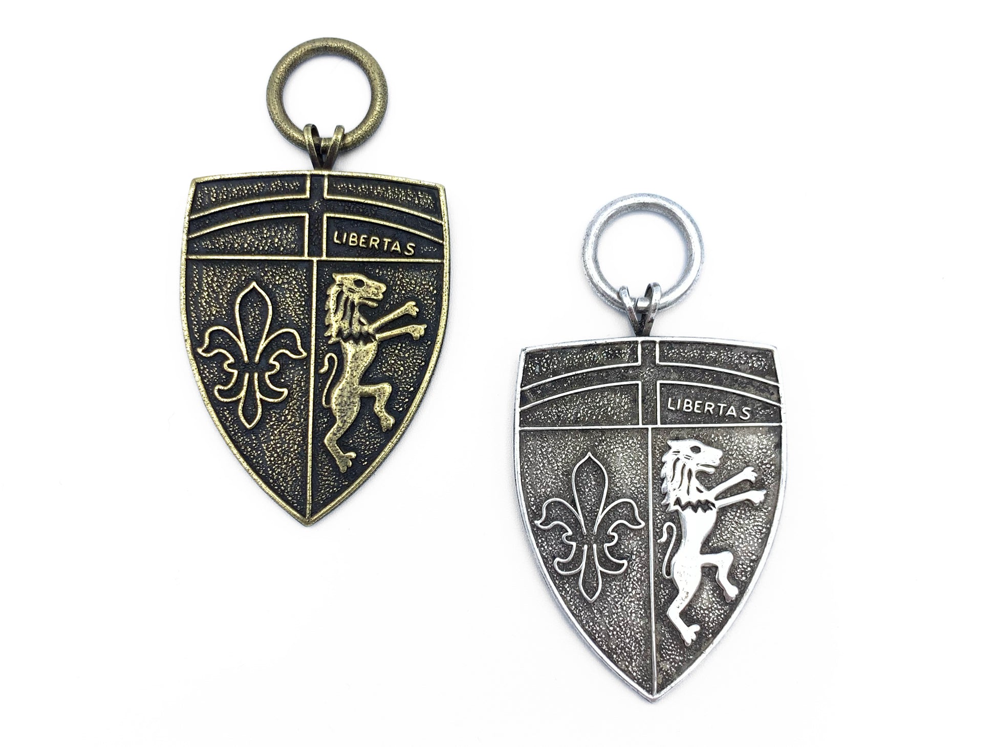 Pair of Large Shield Metals one in brass and one in pewter