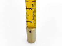 Photo of the metal weighted end of tape measure showing the inches side