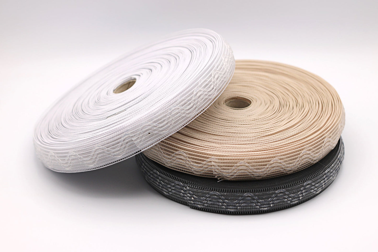 Silicone horsehair elastic. Gripper Elastic. Wig band. Three spools, one of white, beige and black