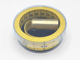 Plumb tape measure coiled in clear plastic case