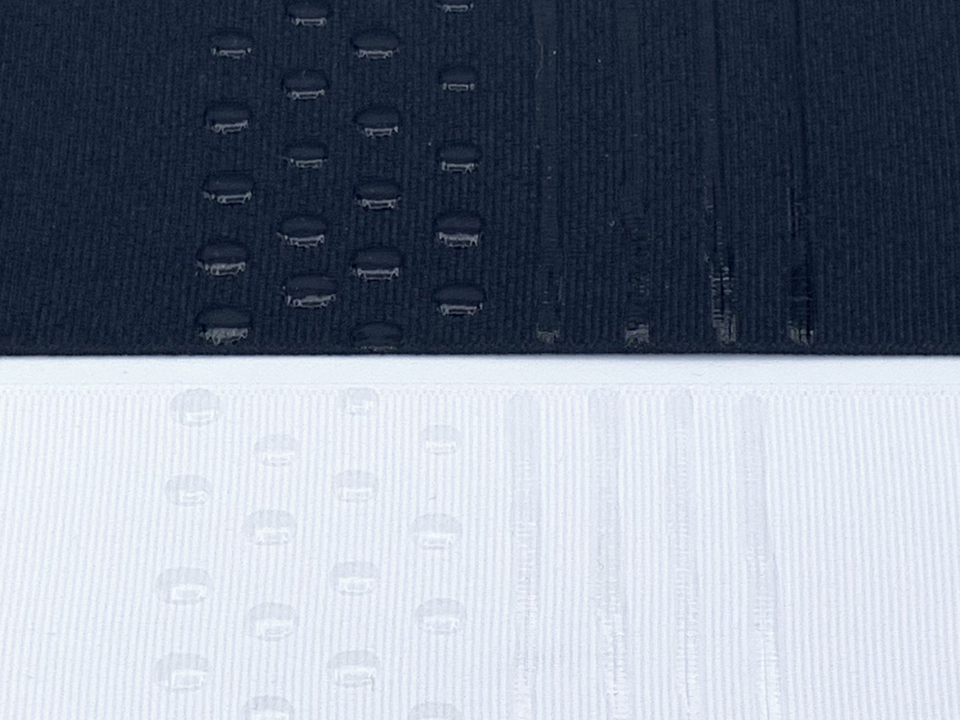 Black and white fabric with transparent sock stop drawn on in dots and stripes