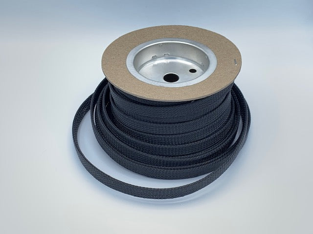 Black heavyweight nylon 1/2" wide coiled on a roll