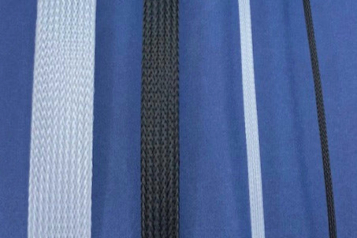 4 pieces of heavyweight horsehair alternating between white and black; 1" wide, 1/2" wide, 1/4" wide, 1/8" wide